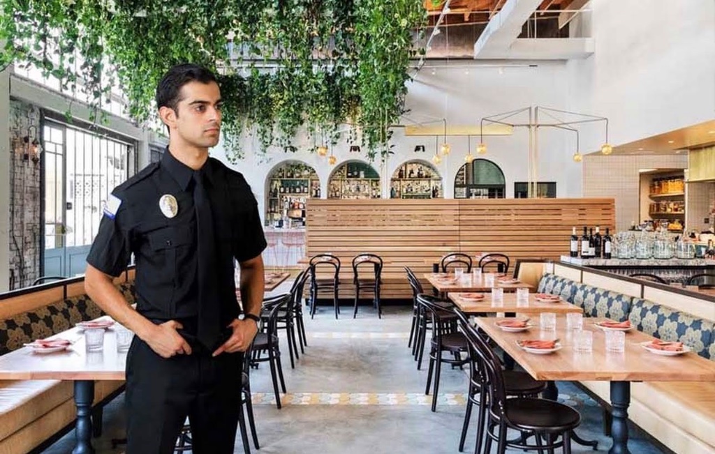 Security officer standing in a restaurant dining room