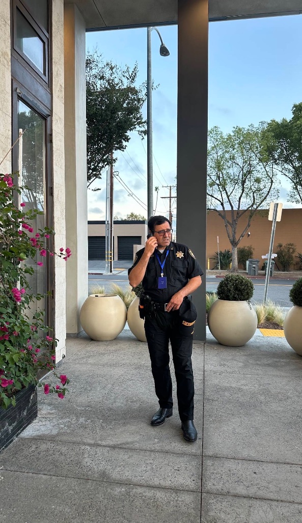 Guard For America officer posted at a commercial building entrance