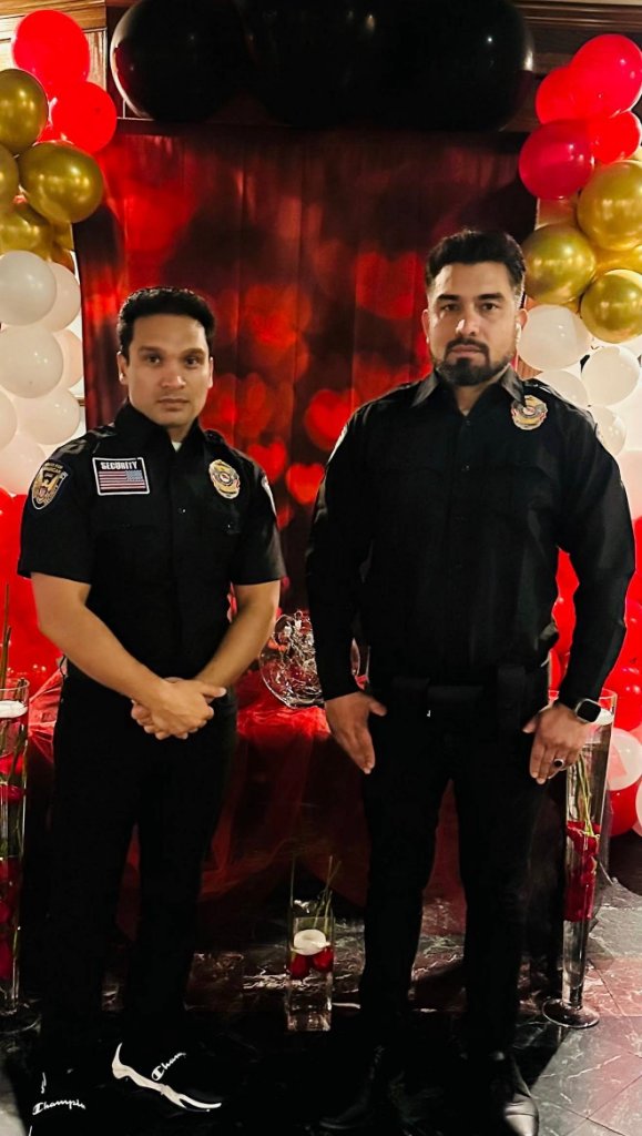 Two Guard For America officers at an evening event