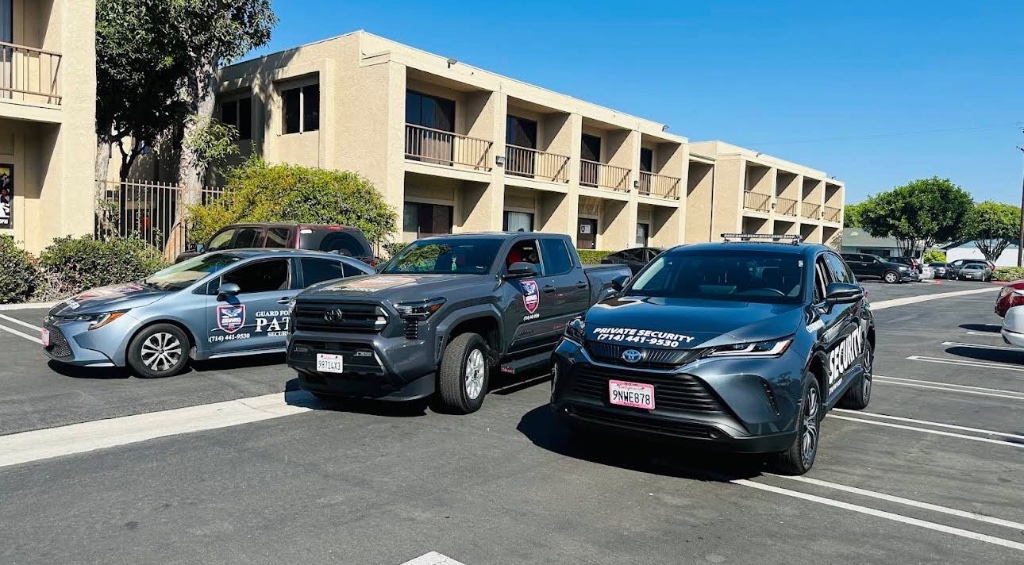 Three Guard For America patrol vehicles parked together