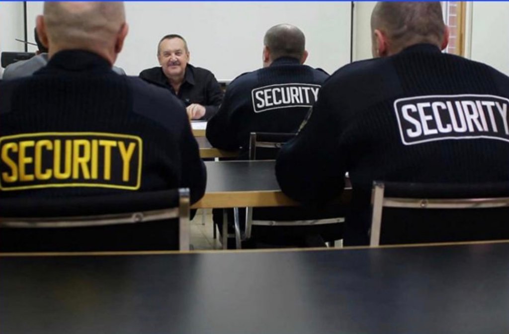 Security officers in a briefing around a table